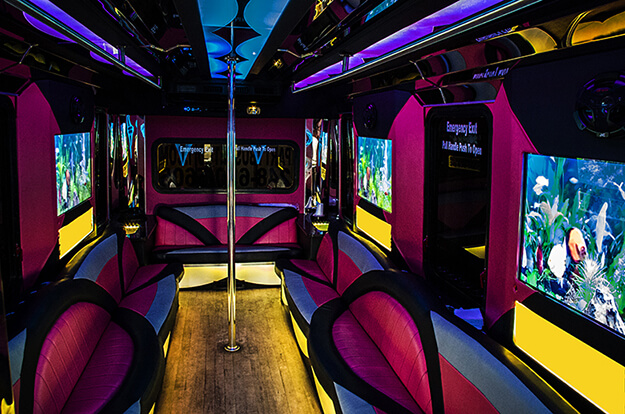 pink Daytona Beach party bus with laser lights and leather seating